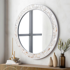Modern round wall mirror with decorative shell frame and clear glass, white bathroom and vanity mirror for contemporary interiors