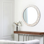 Modern round wall mirror with decorative shell frame and clear glass, white bathroom and vanity mirror for contemporary interiors