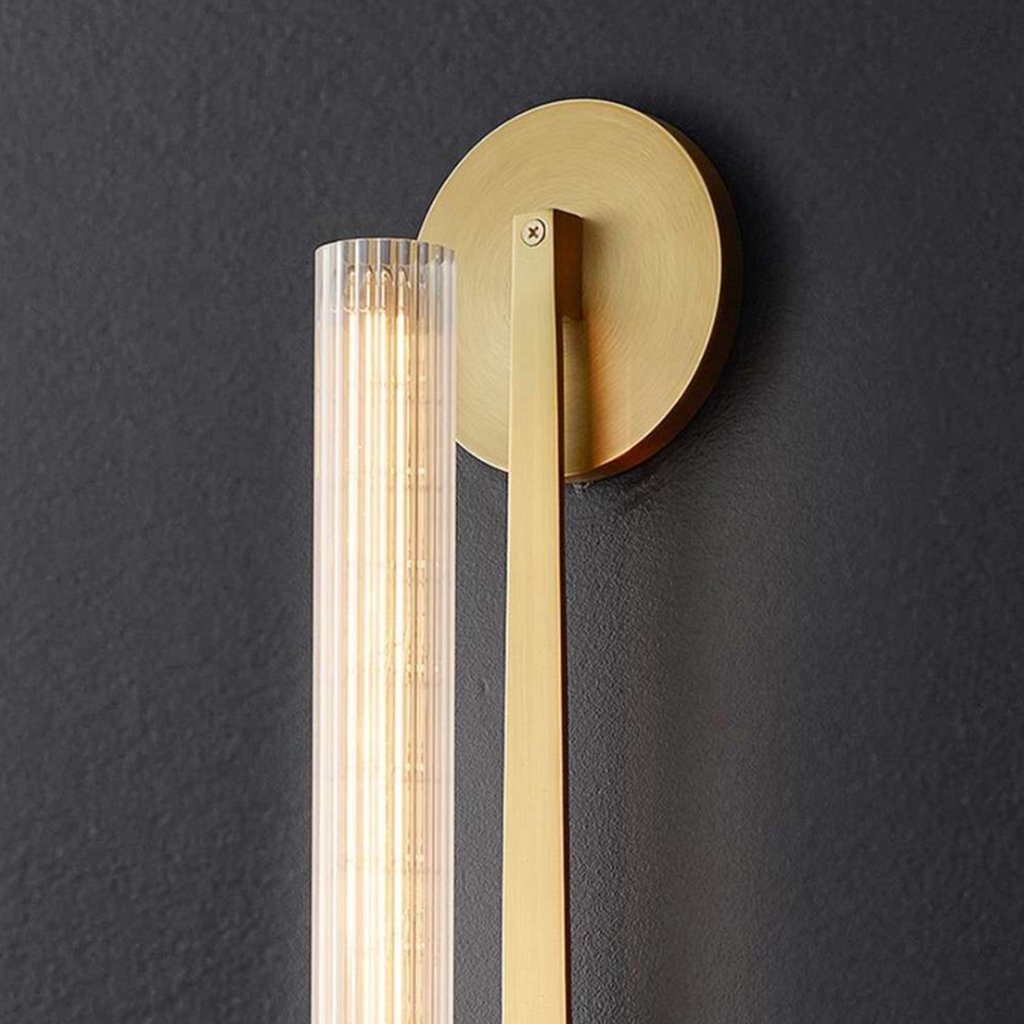Close-up of the clear glass shade on the wall sconce