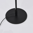 Base detail of modern curved LED floor lamp