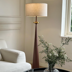 Fabric floor lamp beside a living room sofa