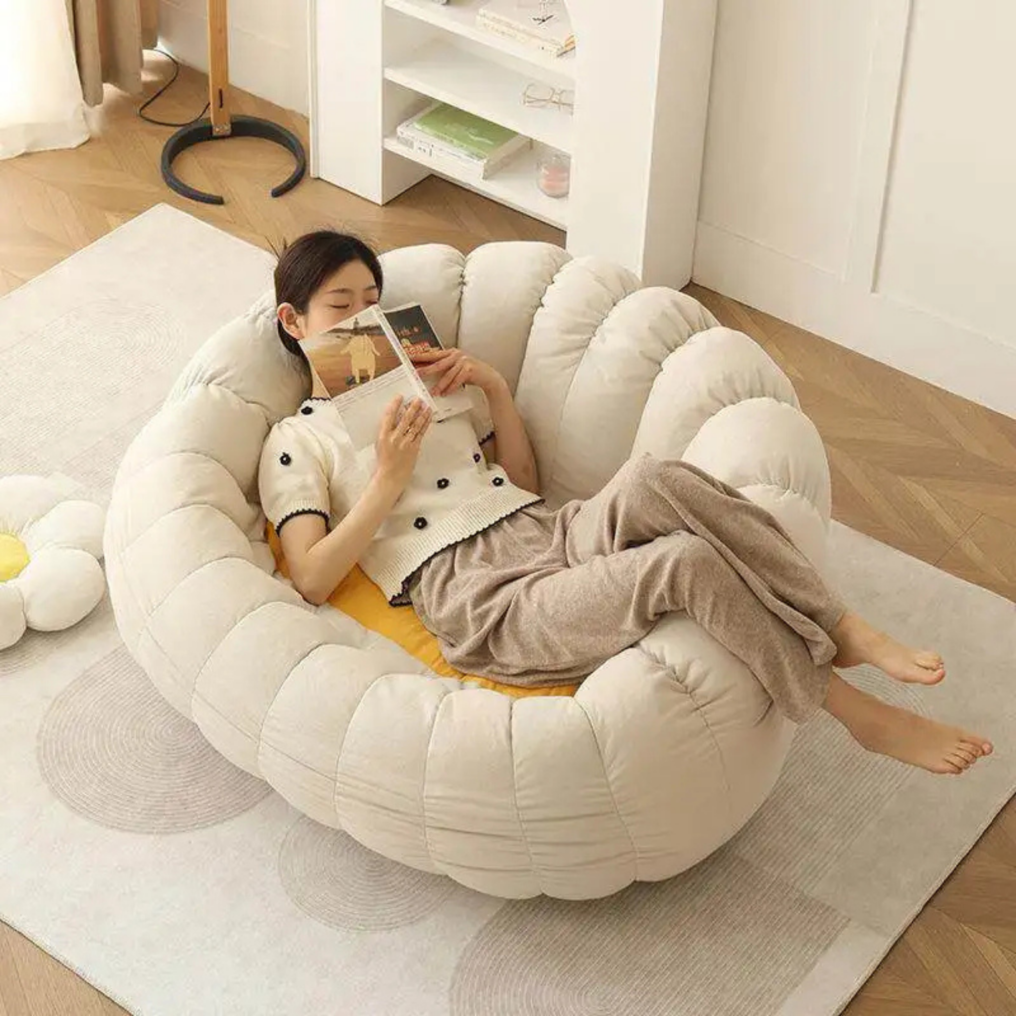 Woman reading in a flower-shaped bean bag chair