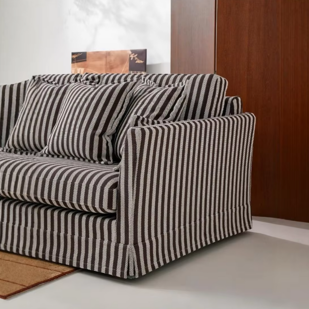 Armrest detail of the French striped sofa