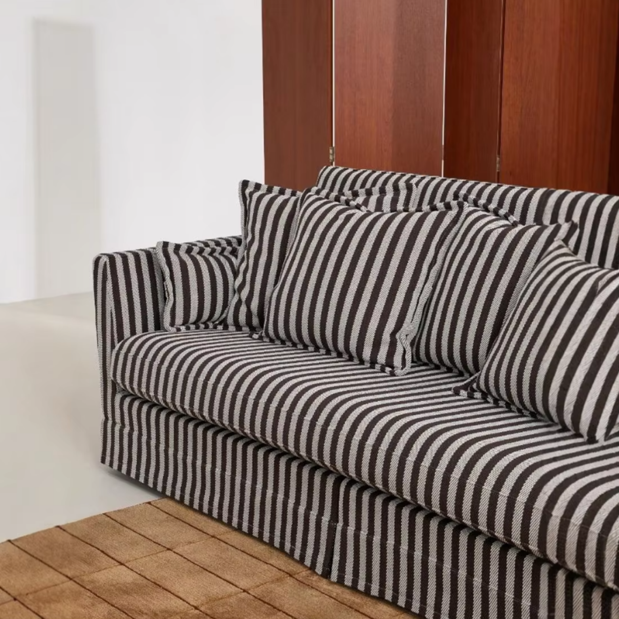 Three-quarter view of the French striped sofa