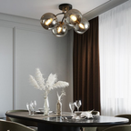 Multi-light glass ceiling fixture in a dining room