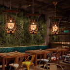 Industrial glass pendant light for a bar