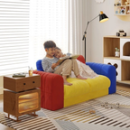 Kids reading on a colorful velvet sofa