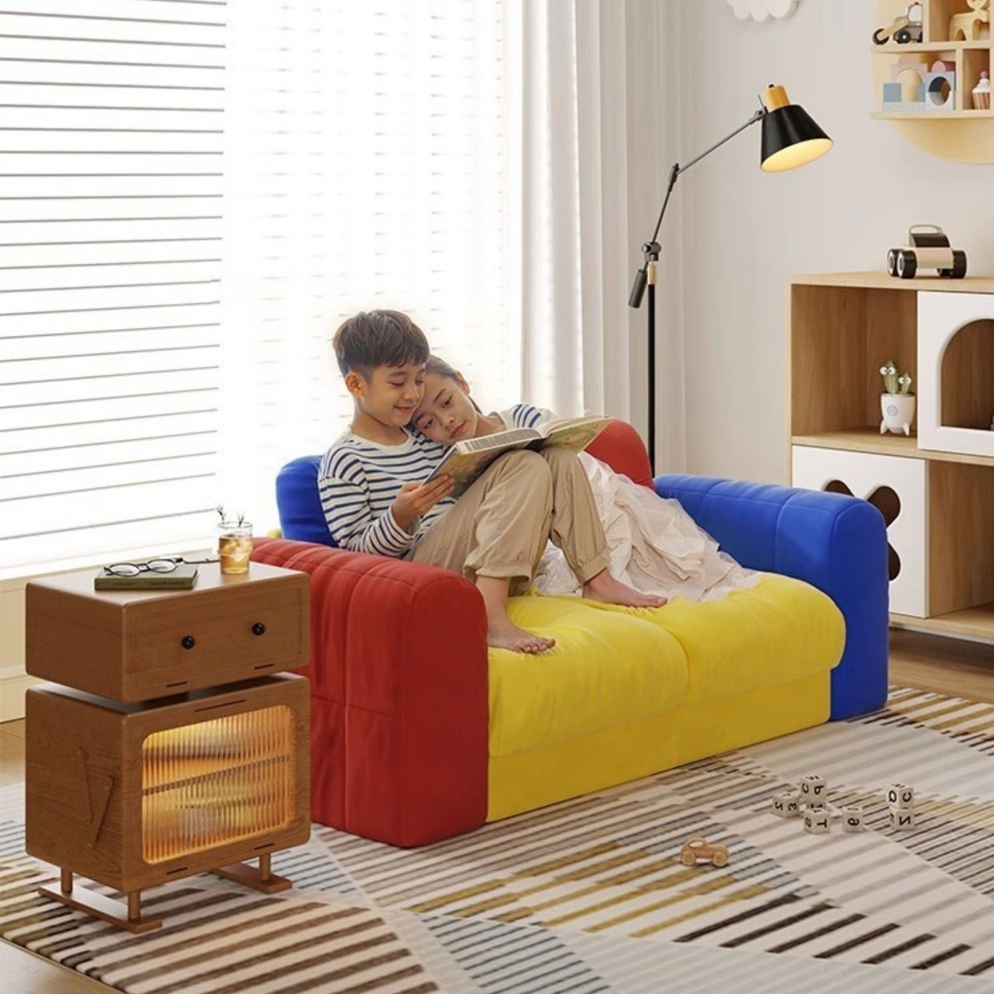 Kids reading on a colorful velvet sofa