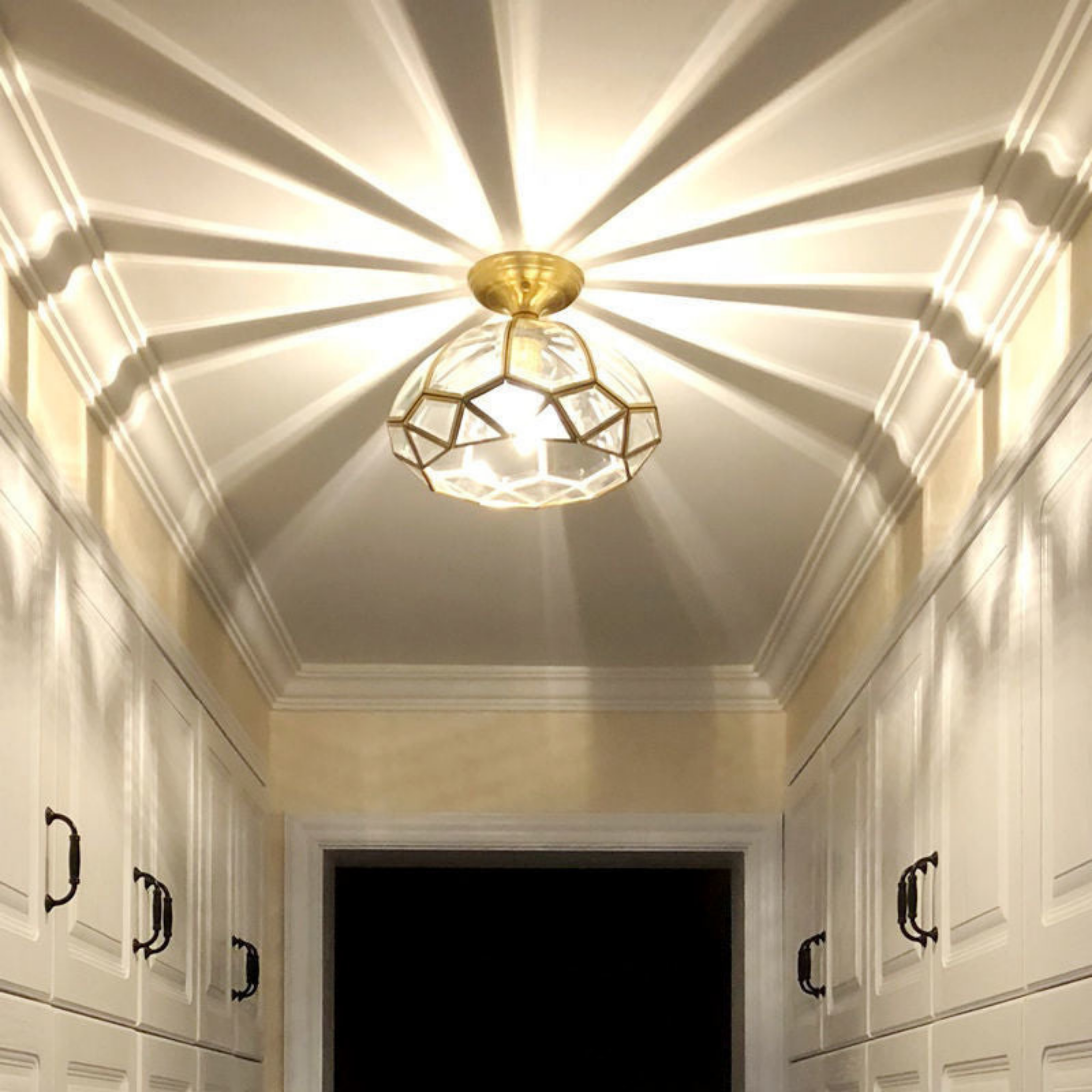 Luxury all copper round glass light in an entryway