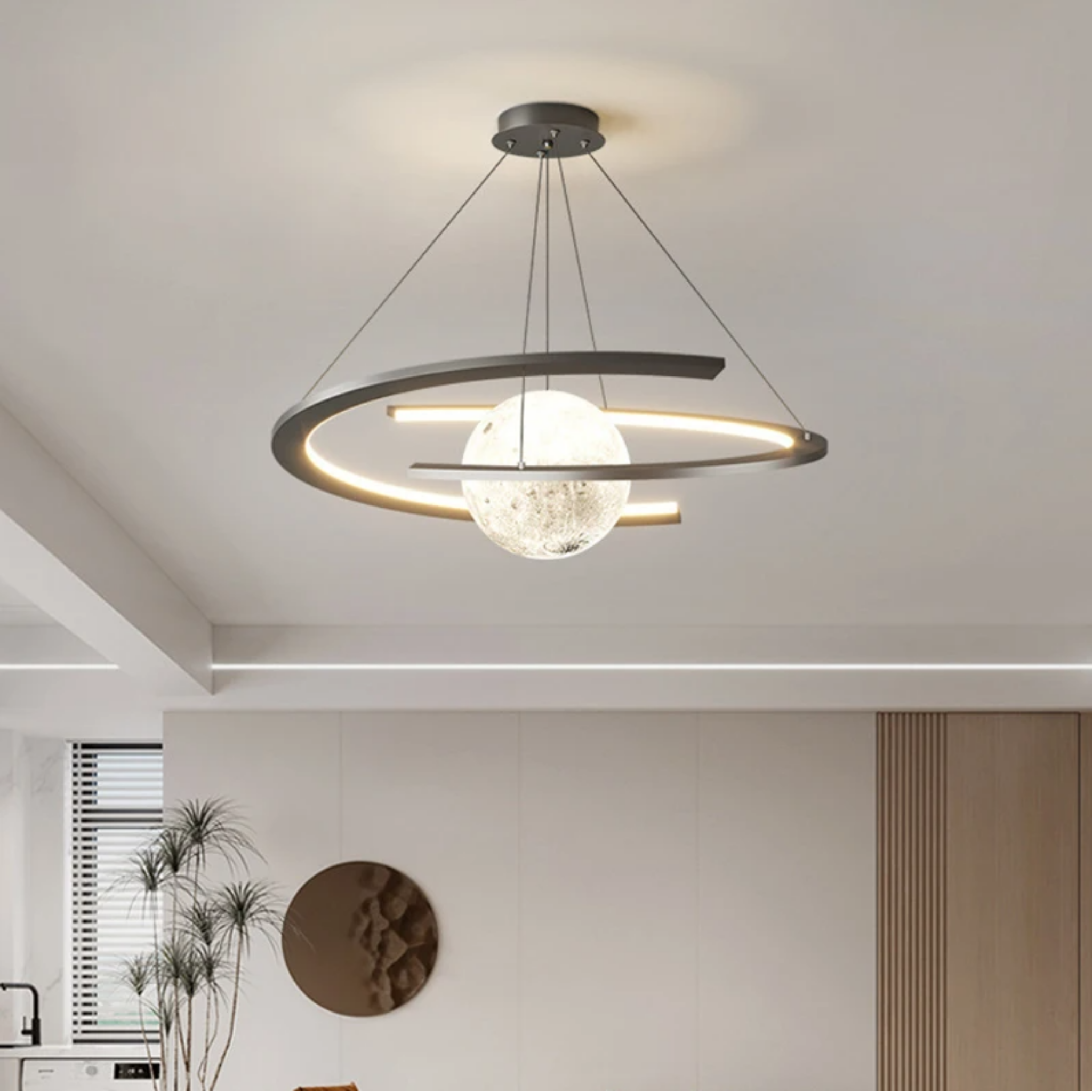 Luxury crescent moon LED pendant chandelier in a bedroom