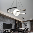 Luxury crescent moon LED pendant chandelier above a dining table