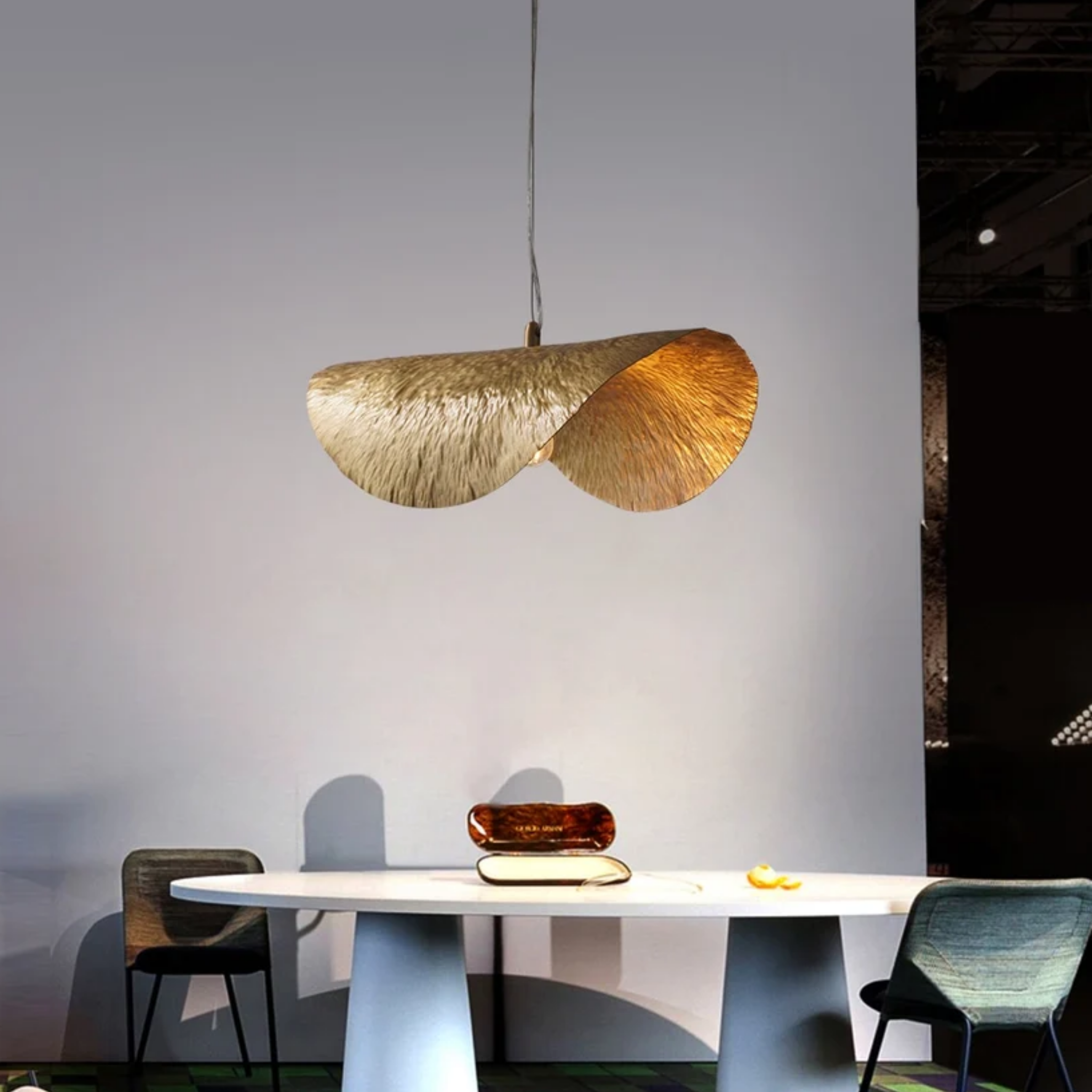 Luxury gold lotus leaf pendant ceiling light above a dining table