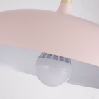 Close-up of metal dome shade on pendant light