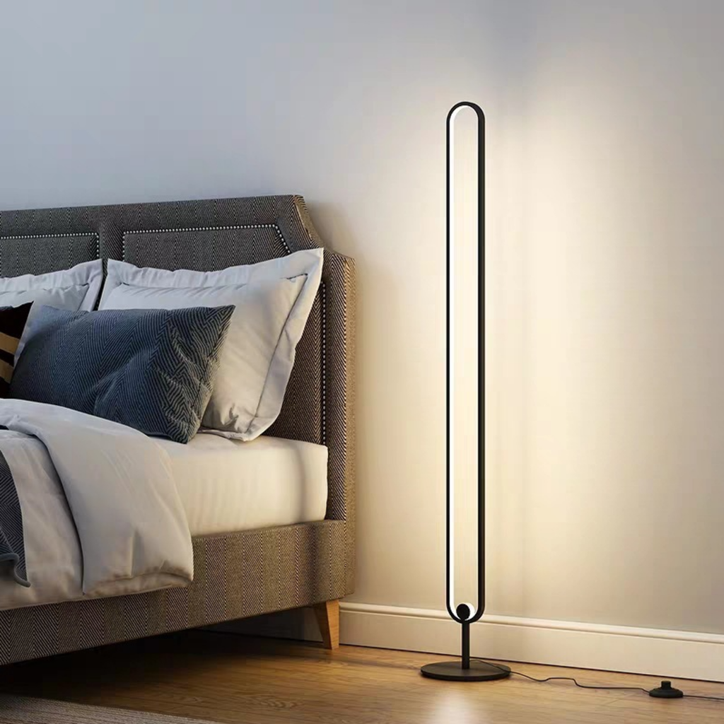 Minimalist LED floor lamp in a bedroom