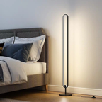 Minimalist LED floor lamp in a bedroom