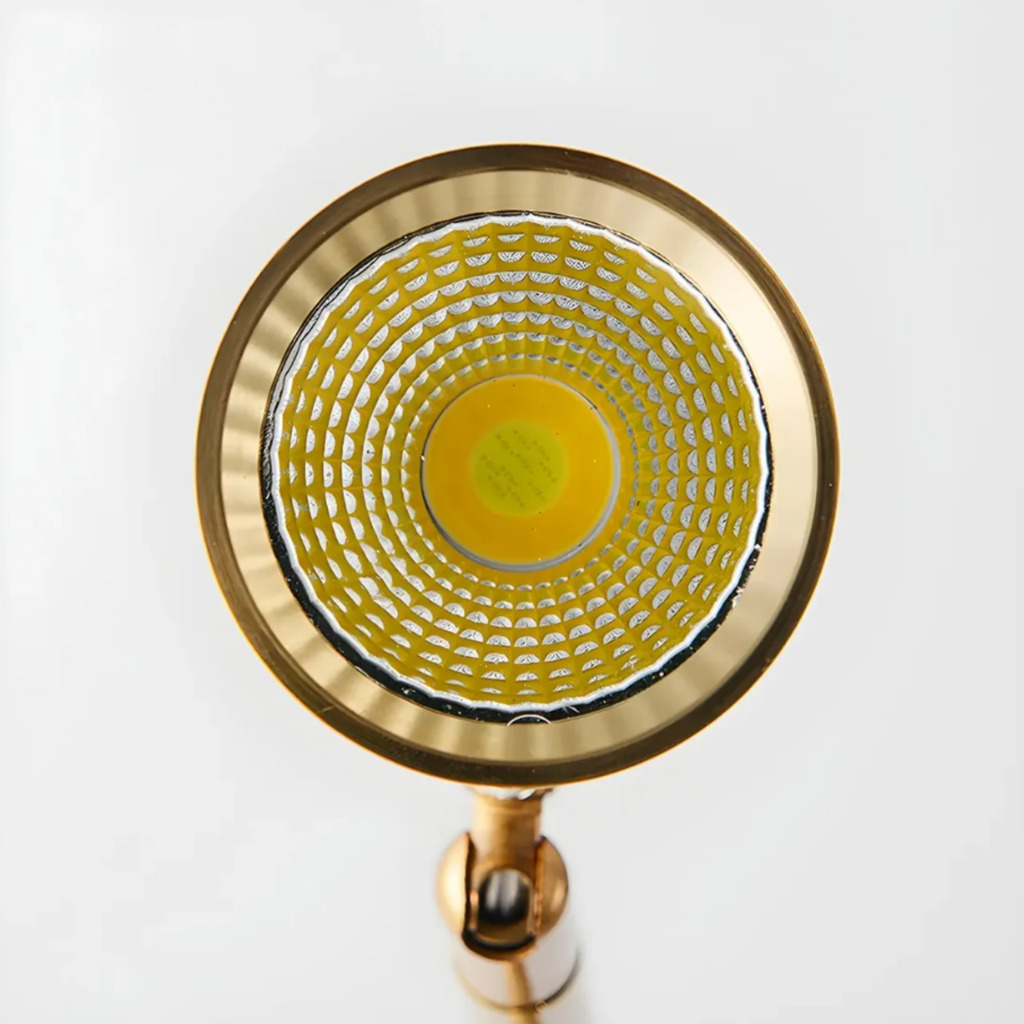 Angled view of the gold modern adjustable LED floor lamp