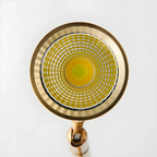 Angled view of the gold modern adjustable LED floor lamp