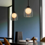 Modern clear glass bell pendant ceiling light in a dining room
