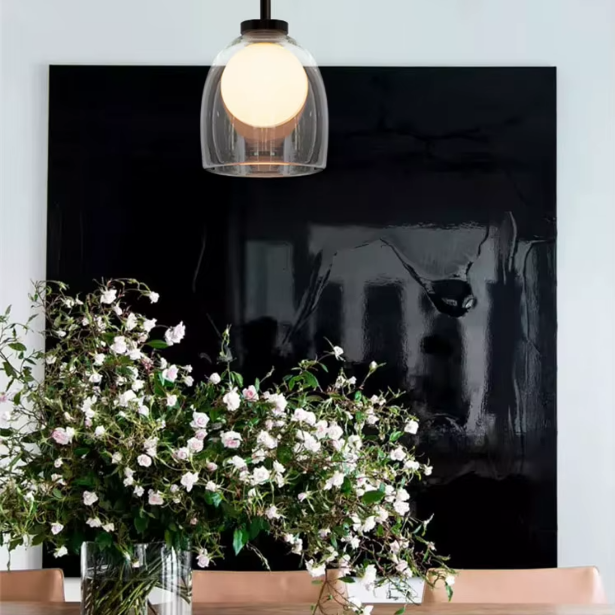 Modern clear glass bell pendant ceiling light in a living room