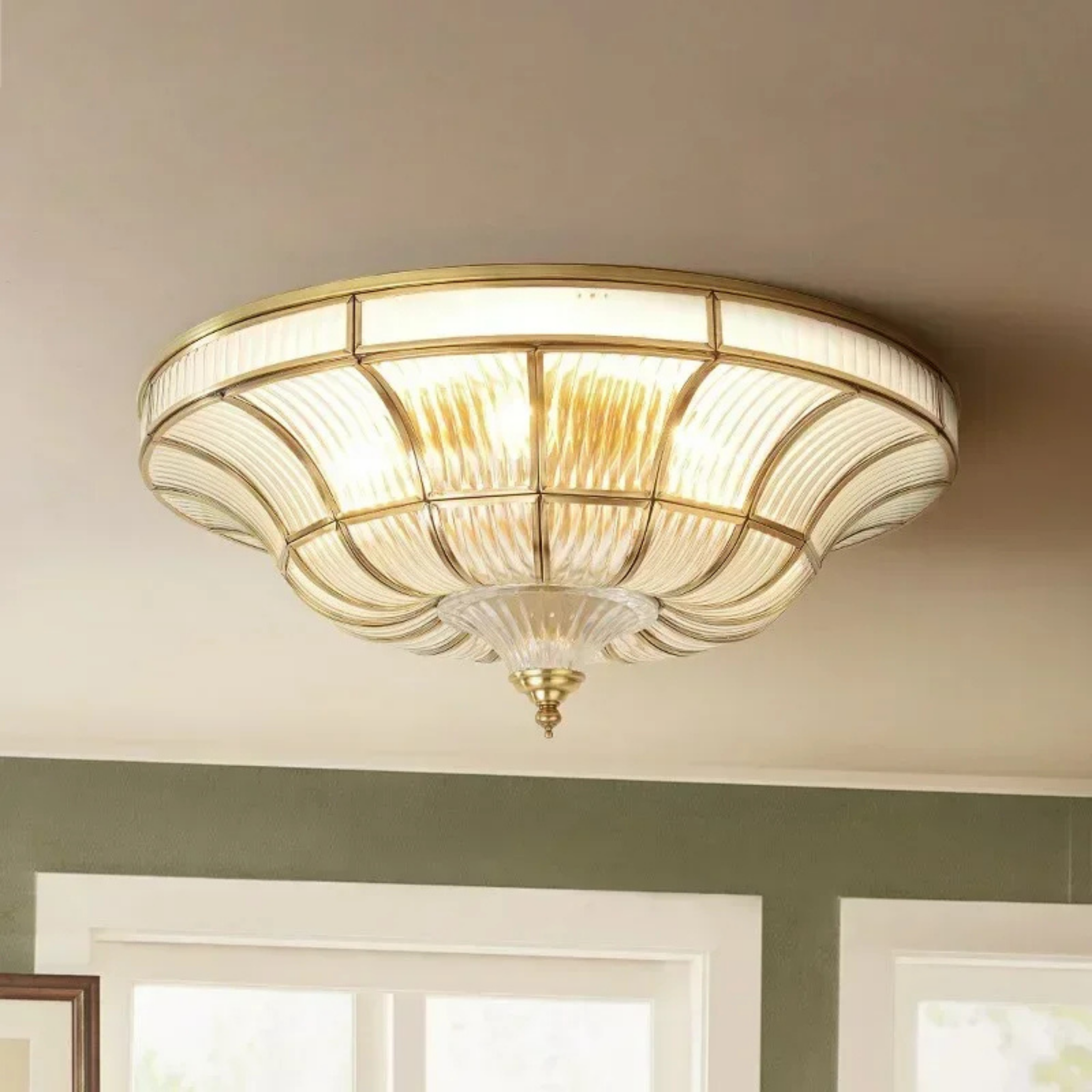 Modern copper flush mount transparent ceiling light in a living room