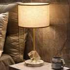 Modern crystal table lamp beside a bed