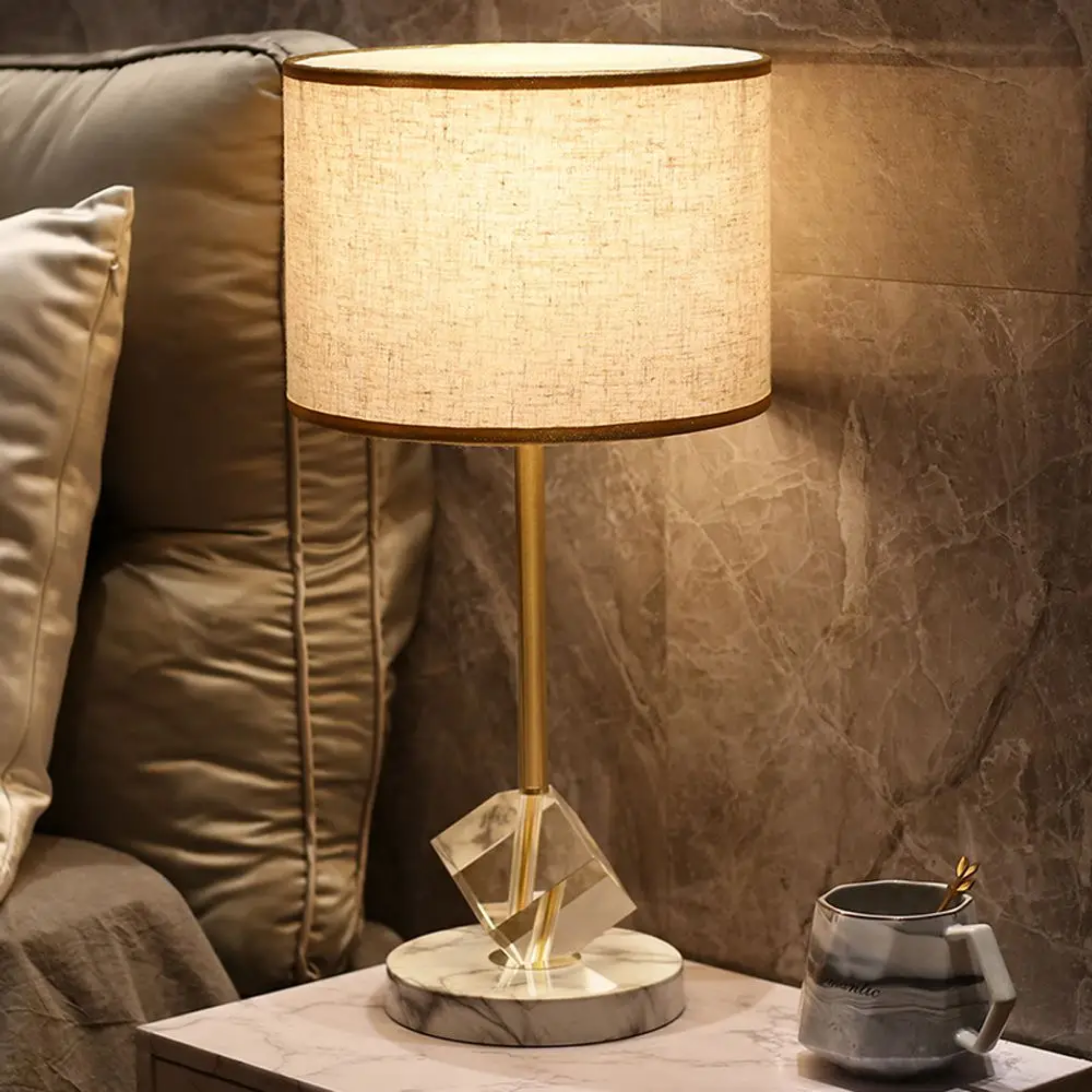 Modern crystal table lamp beside a bed