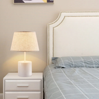 Modern fabric shade table lamp on a bedroom nightstand