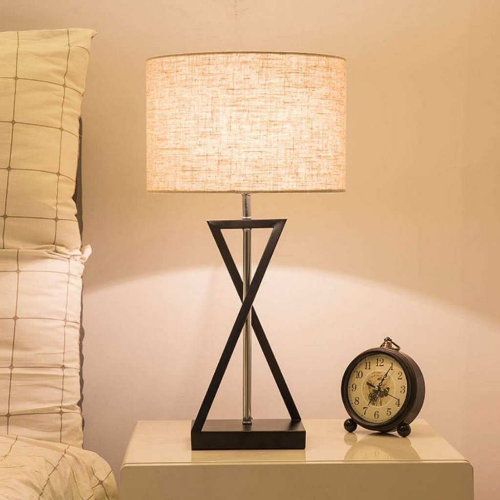 Modern fabric table lamp on a bedside table