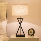 Modern fabric table lamp on a bedside table