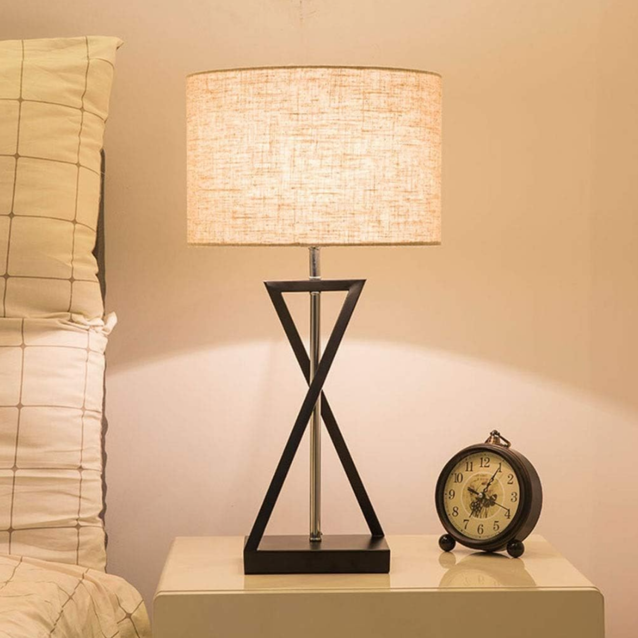 Modern fabric table lamp on a bedside table