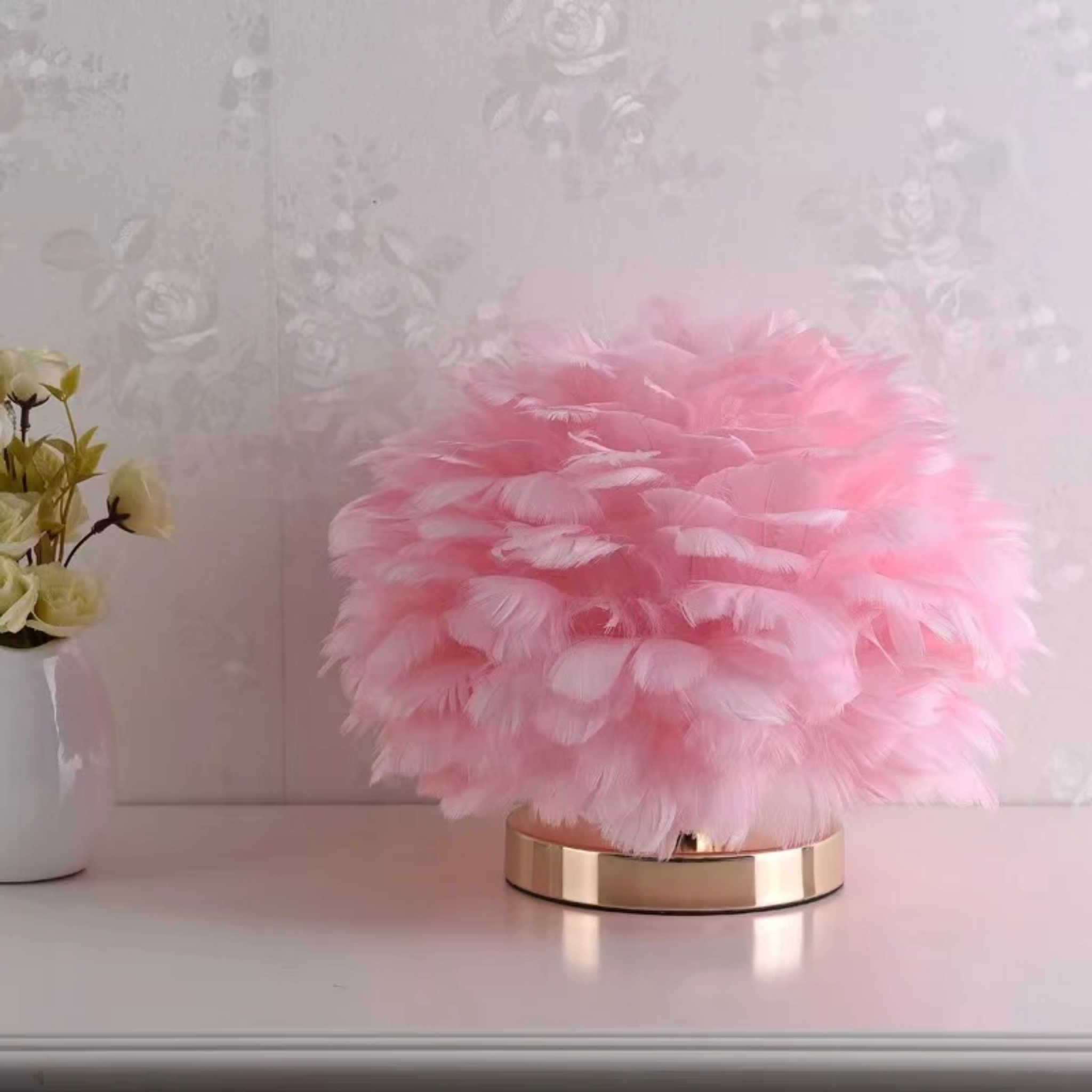 Modern feather globe table lamp in pink turned off