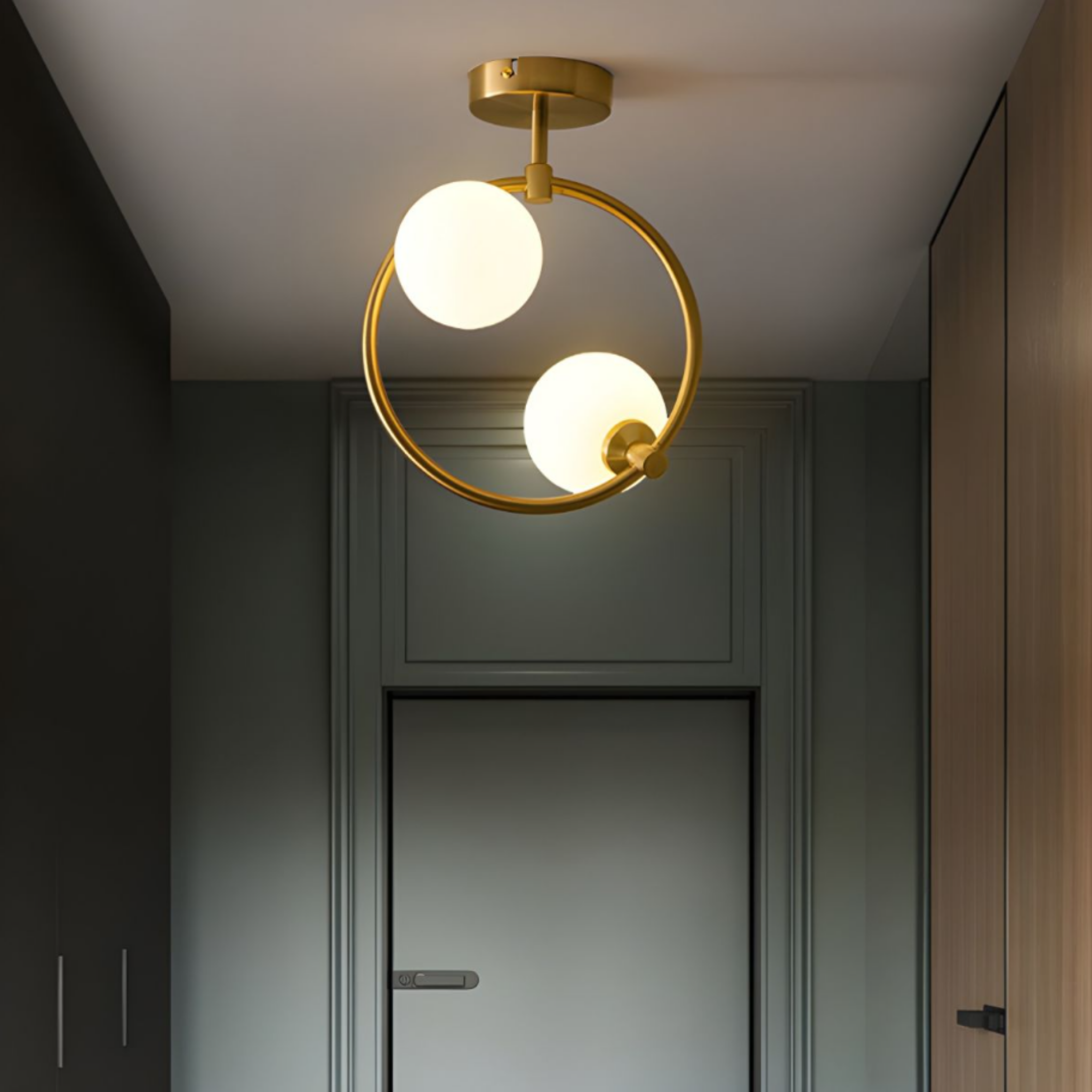 Modern gold glass globe 2 head chandelier in an entryway