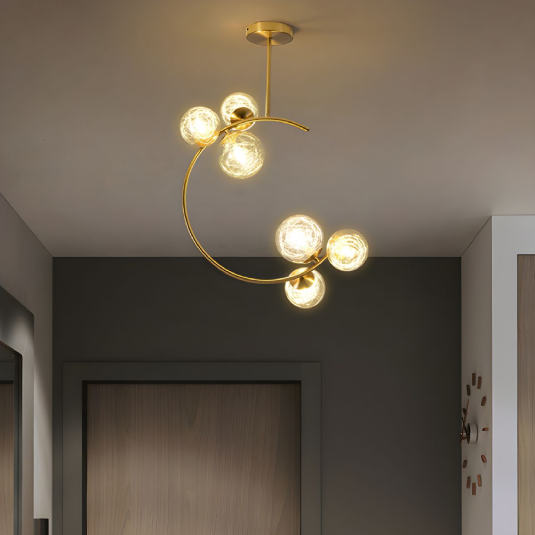 Modern gold glass globe 6 head chandelier in an entryway