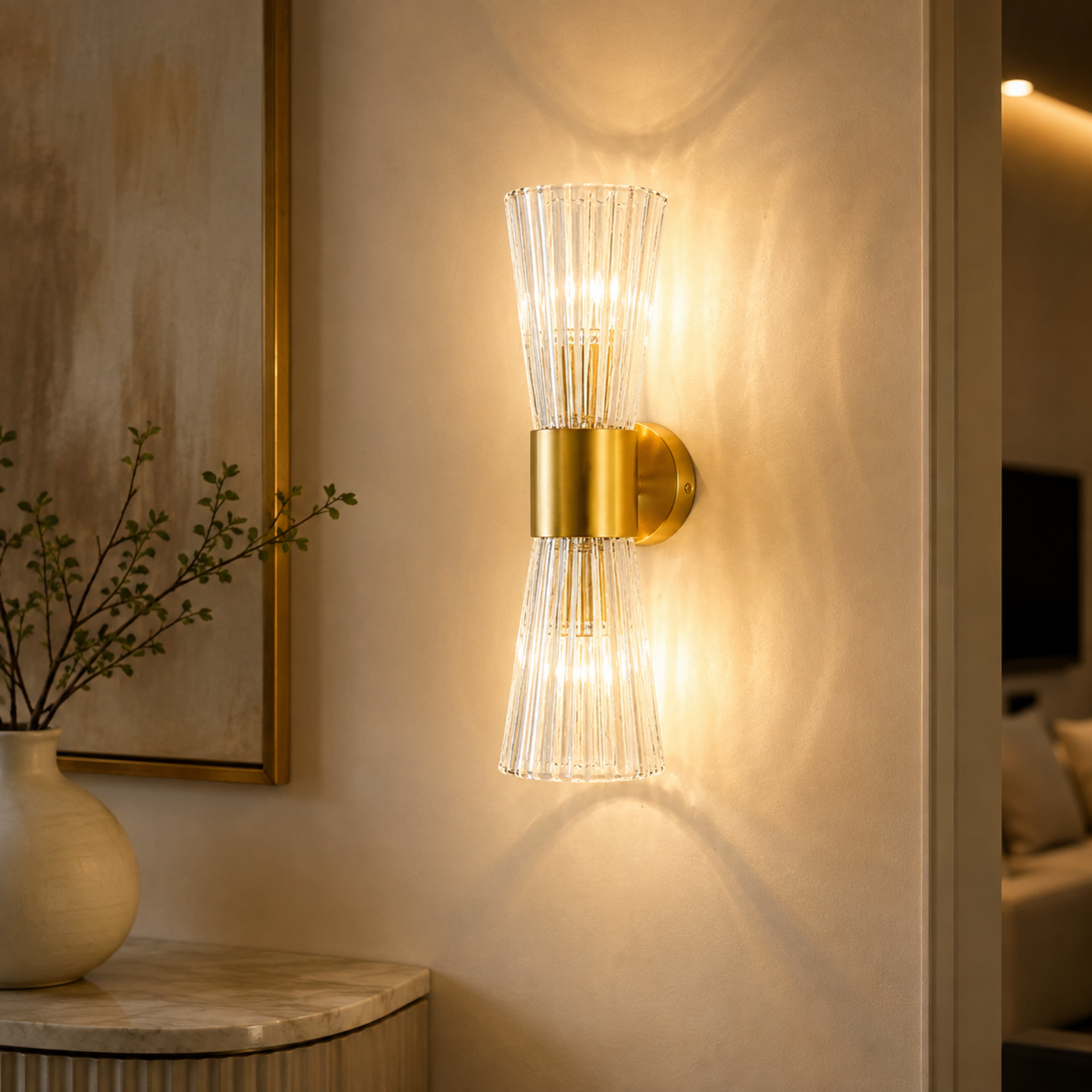 Modern gold LED wall sconce in a hallway