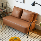 Modern leather sofa side view with upholstered backrest and armrests