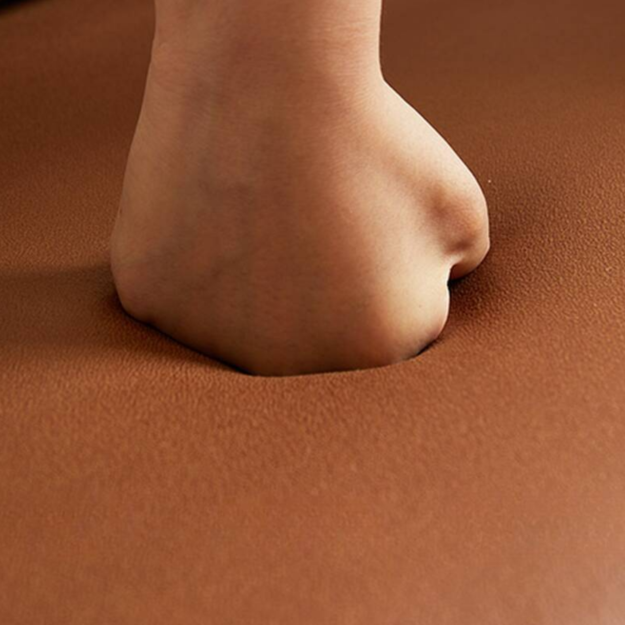 Close-up of leather upholstery on modern living room sofa