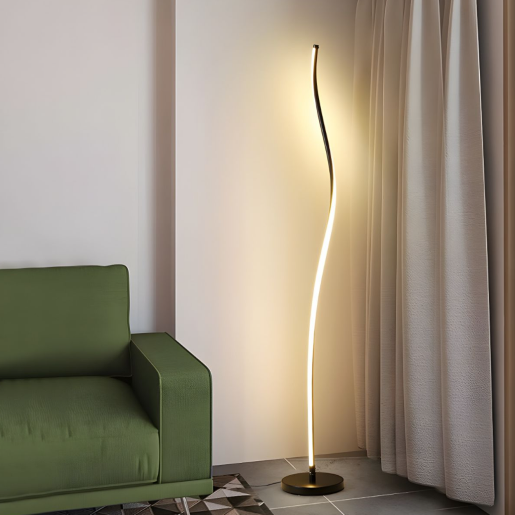 Modern curved LED floor lamp beside a sofa