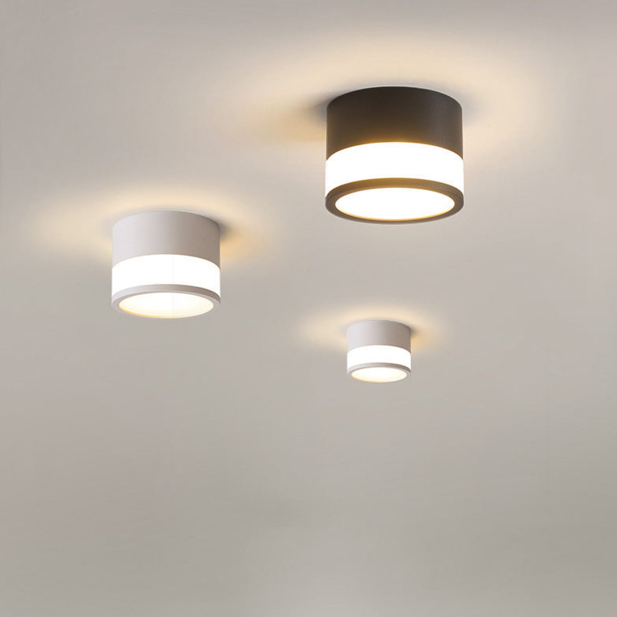 Three modern LED flush mount ceiling lights installed on the ceiling