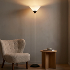 Modern LED standing floor lamp in black in a reading corner