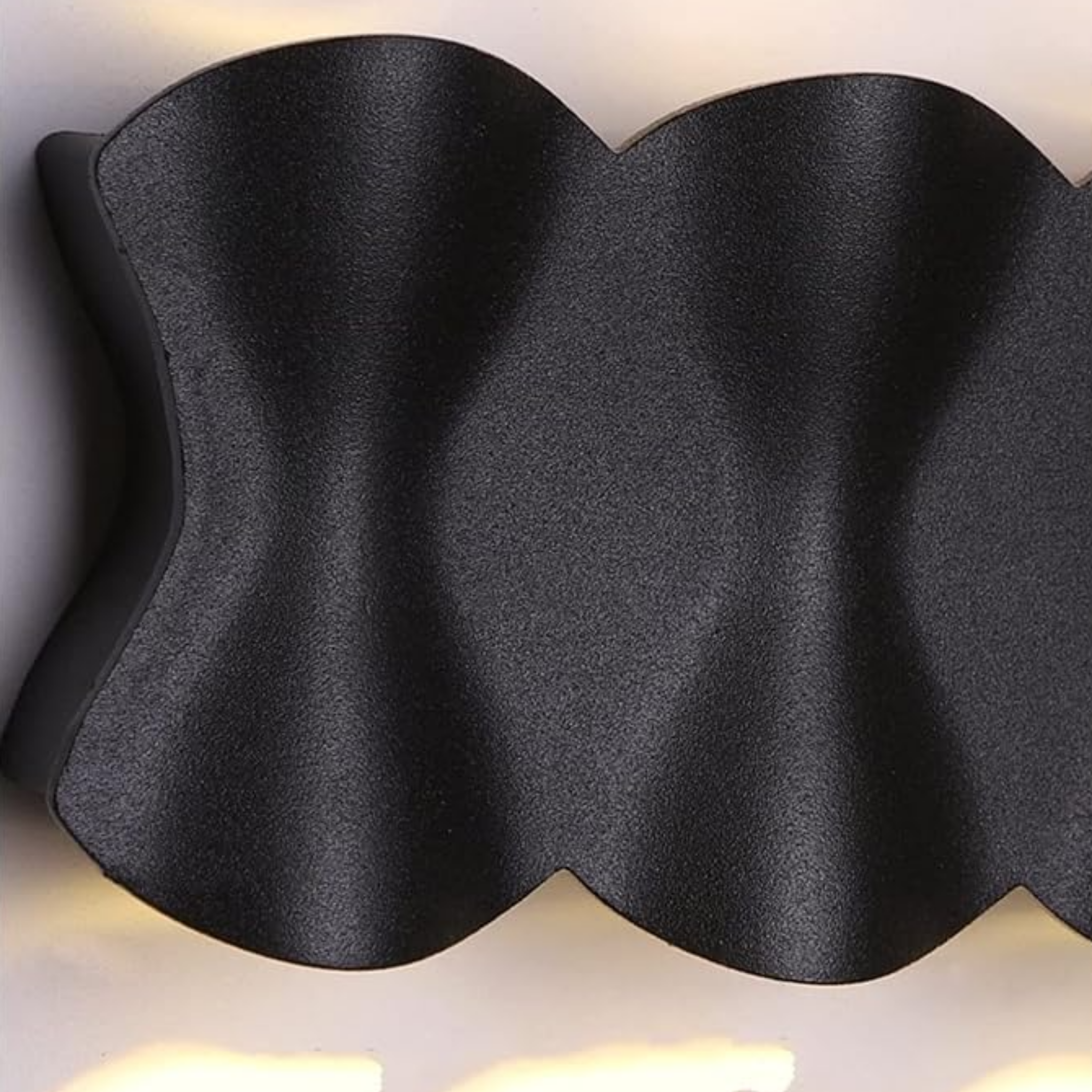 Close-up of the aluminum body of the LED wall sconce