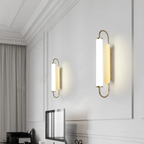 Modern luxury gold LED wall sconce in a cabinet