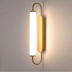 Modern luxury gold LED wall sconce turned on