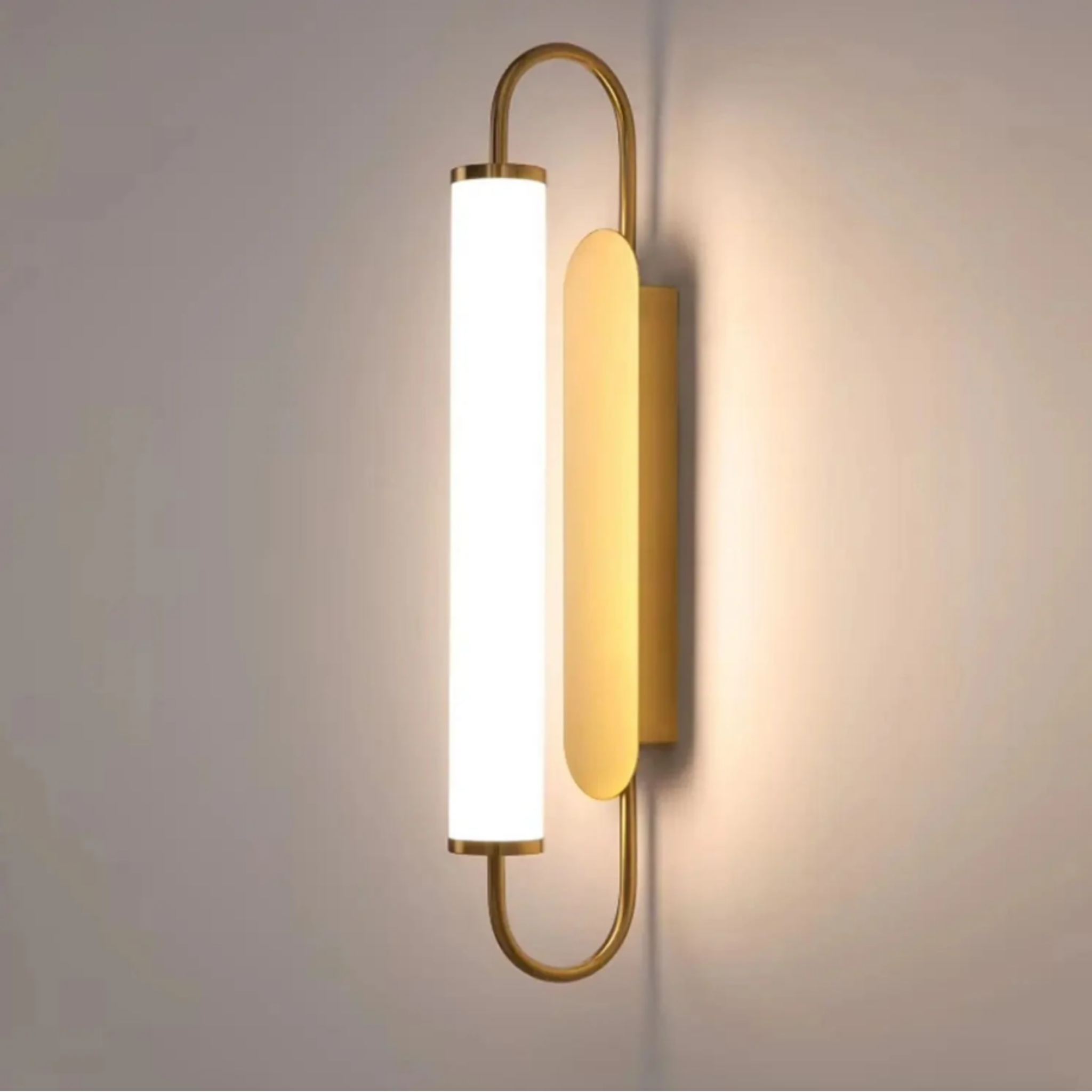 Modern luxury gold LED wall sconce turned on