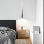 Modern minimalist black aluminum stick LED pendant ceiling light in a bedroom
