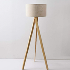 Modern minimalist solid wood tripod floor lamp turned off