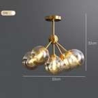 Modern Nordic copper pendant chandelier with smoke gray glass shades turned on