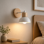 Modern Nordic wood and metal wall sconce in a bedroom