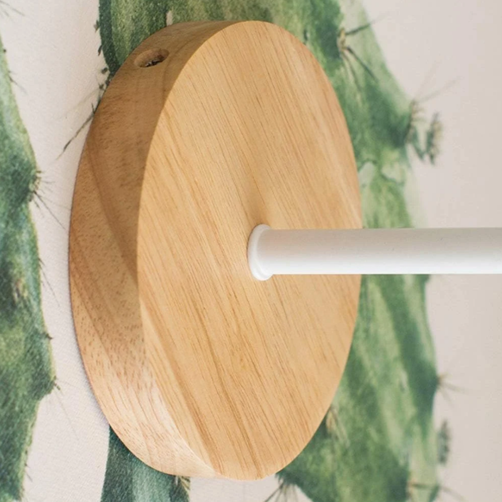 Close-up of the wooden base of the wall sconce