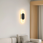 Modern oval LED wall sconce in a living room