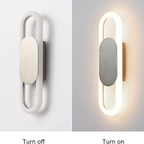 Modern oval LED wall sconce turned off